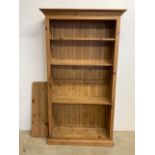 A set of solid pine shelves with adjustable pegs. W:104cm x D:37cm x H:184cm