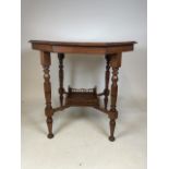 An early 20th century mahogany octagonal table with galleried shelf below. With ornately turned