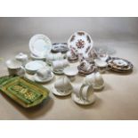 A Colclough china part tea set, an Elizabethan part tea set, Royal Doulton plain white tea cups