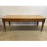 A large Victorian farmhouse kitchen table, top with four wide planks on turned legs. W:212cm x D: