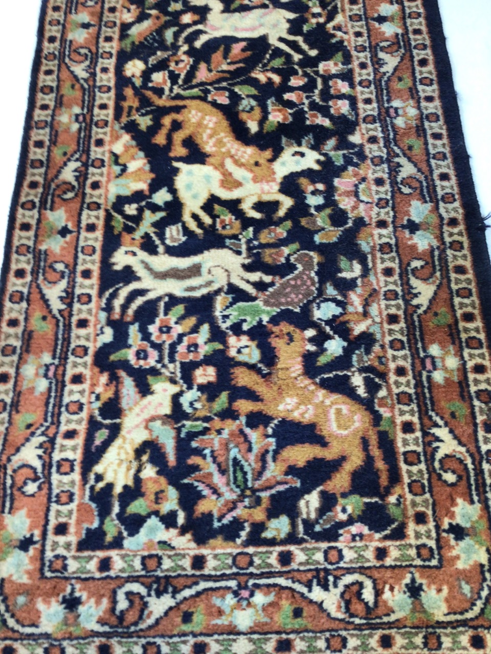 A vintage Persian wool rug with navy ground and hunting animalsW:46cm x H:137cm includes fringe - Image 2 of 4