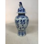 A Delft hall vase with a dogs of Foe finial in the chinoiserie style. Repair to top - see photo