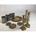 A collection of brass and pewter items including two pairs of candle sticks and two vintage blow