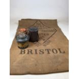 Three vintage tins together with a West of England Sack stamped Bristol