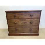 A Victorian mahogany chest of three drawers with turned handles.W:110cm x D:52cm x H:89cm