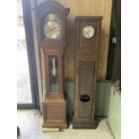 A Julian Stanton Winchester clock also with a carved battery operated longcase clock converted