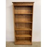 A modern set of adjustable solid pine book shelves. W:90cm x D:28cm x H:198cm