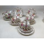 A vintage British Anchor Chintz tea set including six cups and saucers and five tea plate,