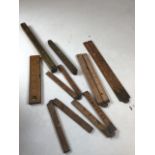 Six early twentieth century carpenters measures together with two spirit levels