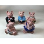 A set of five Wade Nat West piggy banks