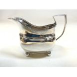 A silver sauce boat wwith graduated border. London 1906. 184 grams.
