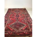 A vintage handmade Iranian rugW:95cm x H:156cm includes fringe