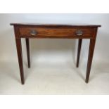 A Georgian mahogany side table with large central drawer and brass handles with fluted legs. W: