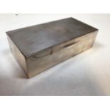 A silver cigarette box wood lined, hall marked to side W:18cm x D:19cm x H:5cm