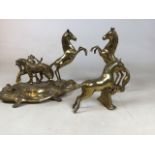 A pair of brass rearing stallions together with a brass inkwell and a jumping horse Height of