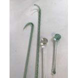 Two Nailsea glass walking sticks together with two Nailsea drumsticks H:130cm longest walking