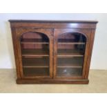 A Victorian walnut and inlaid glazed bookcase. W:106cm x D:44cm x H:90cm