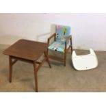 A 1960s metamorphic high chair. Chair has been recovered