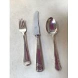 A matched silver christening set consisting of a knife, fork and spoon