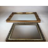 A large bevel edge mirror with ornate gold frame W:90cm x H:65cm. Together with a smaller mirror