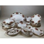 A Royal Albert Country Rose dinner service comprising eight dinner plates, eight 20cm plates,