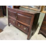 A 19th century oak sideboard with cupboard above drawers. Back leg is broken. W:116cm x D:44cm x