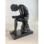 A bronze statue of Spinario the thorn boy on rectangular base. Late 19th century