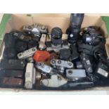 A collection of camera and lenses to include Praktica Olympus etc.