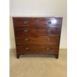 A Victorian mahogany chest of drawers with two short over three long drawers. With brass