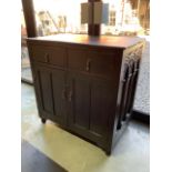 An early 20th century and earlier cupboard with two drawers above. Internal shelves and metal