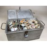 A tin box full of mixed cigarette and tea cardsW:40cm x D:25cm x H:20cm