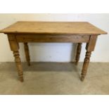 A Victorian pine kitchen table with later top added. W:108cm x D:60cm x H:76cm.
