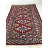 A vintage handmade rug W:74cm x H:127cm