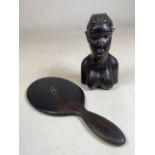 A solid ebony carved African figure also with a 19th century ebony silver initialled hand mirror.