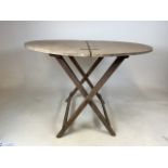A circular French folding wine table, with carry handles and locking action. W:92cm x D:92cm x H: