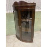 A Small 20th century curved glass corner cupboard with working key. W:41cm x D:41cm x H:90cm