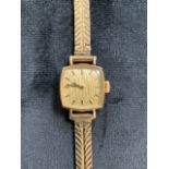 A 9ct gold ladies cocktail watch with Swiss made movement marked Buren 17 jewels.