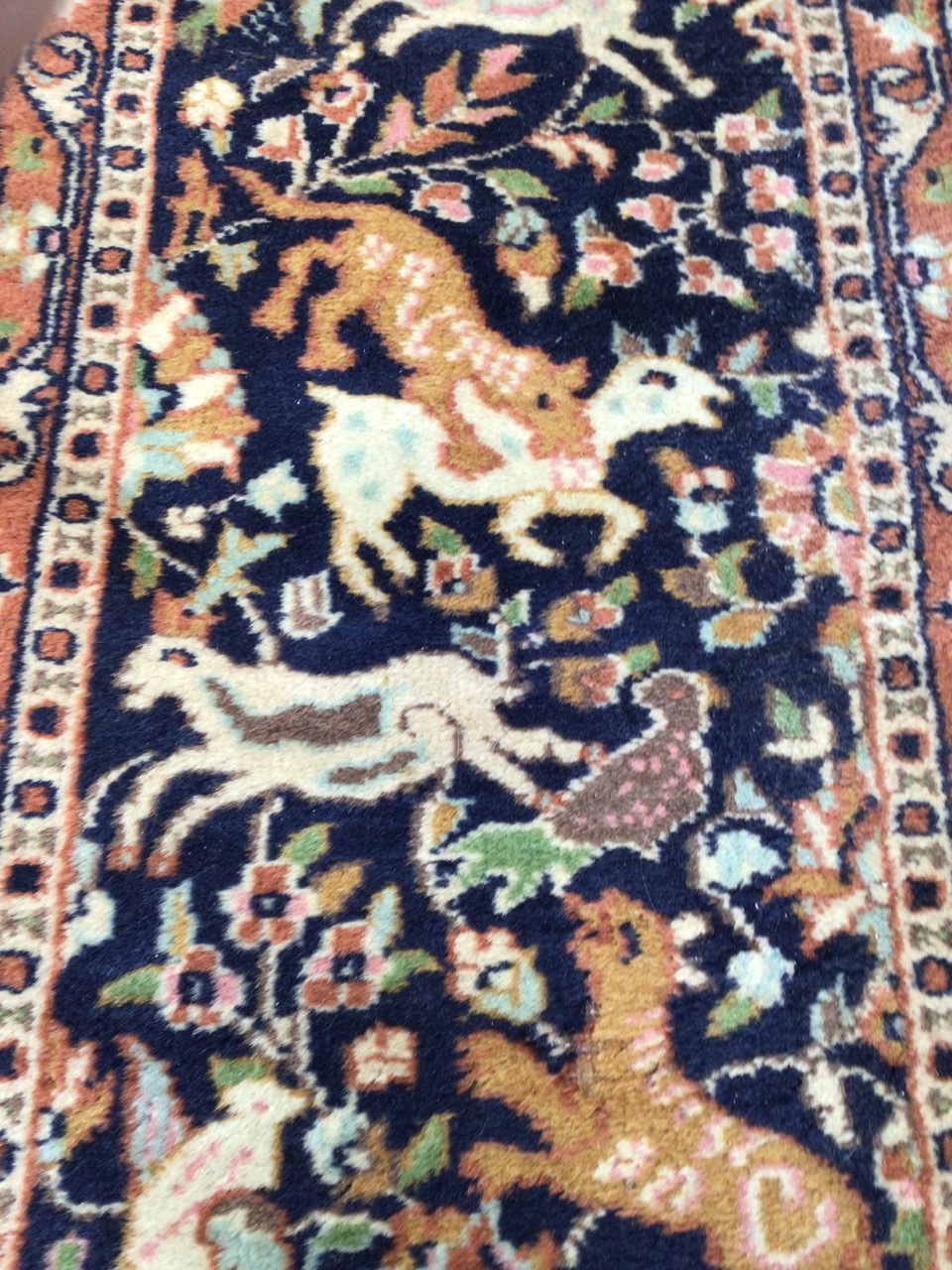 A vintage Persian wool rug with navy ground and hunting animalsW:46cm x H:137cm includes fringe - Image 3 of 4