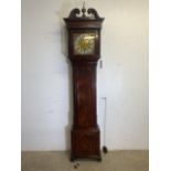 A 19th century flame mahogany grandfather clock by THOMAS HARGREAVES of Settler with brass and