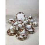 Royal Albert Country Roses tea set. Includes teapot, jug, sugar bowl, cake plate, eleven cups and