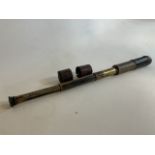 An brass extendable telescope with leather end protectors.H:60cm