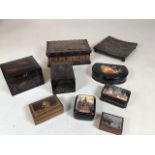 A collection of ornamental boxes including lacquered boxes, inlaid box, painted box and a leather