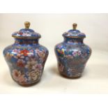 A pair of Chinese lidded cloisonne vases decorated with flowers and butterfliesW:15cm x H:21cm