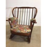 A Ercol style rocking chair. With cushions. W:84cm x D:77cm x H:93cm