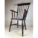 A 19th century elm seated stick back Windsor grandfather chair. Seat height H:45cm