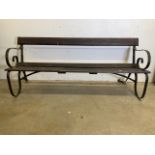 A Victorian style garden bench with scroll arms and support stretchers. W:183cm x D:70cm x H:76cm