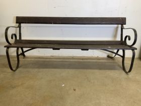 A Victorian style garden bench with scroll arms and support stretchers. W:183cm x D:70cm x H:76cm