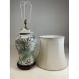 A Chinese hand painnted lamp with silk shade. H:52cm