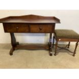A mahogany desk with two large drawers, galleried top and stretcher also with a bentwood upholstered