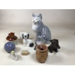 A large hand painted ceramic cat together with a Royal Doulton Westie, a flat back hand painted dog,